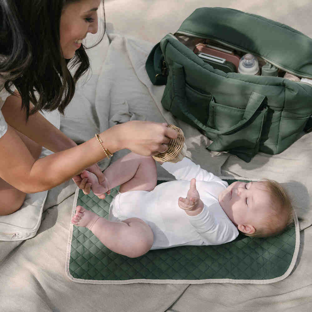 green maternity bag with diaper change