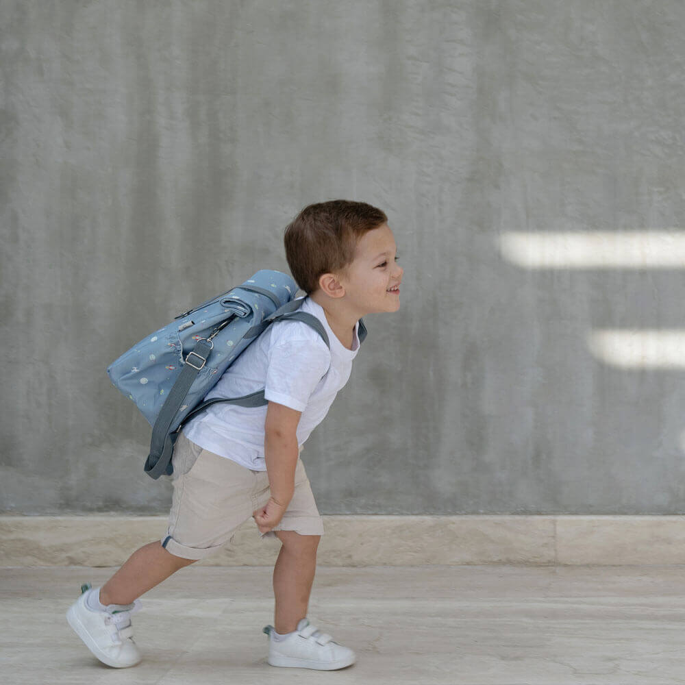 spaceship roll up back pack worn by boy